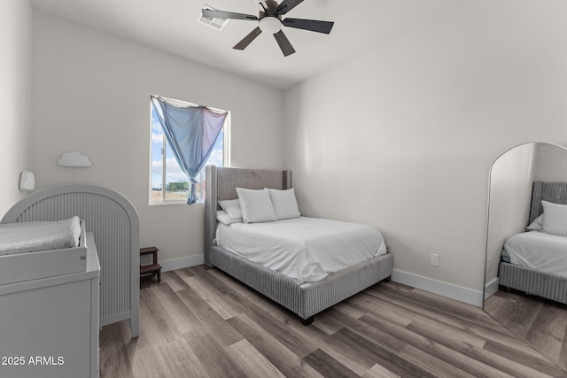 bedroom with hardwood / wood-style floors and ceiling fan