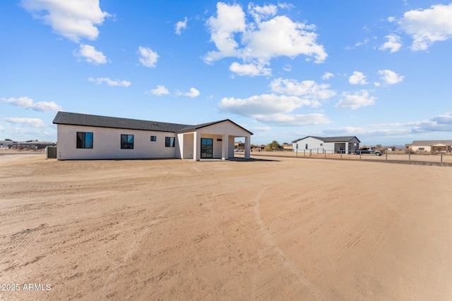 28813 N 201st Ave, Wittmann, AZ 85361 - view of front of home with fence and stucco siding