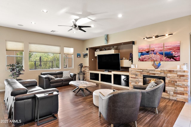 26036 N 85th Dr, Peoria, AZ 85383 - living room featuring a ceiling fan, recessed lighting, wood finished floors, and a stone fireplace
