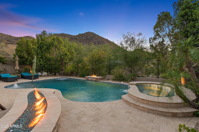 26036 N 85th Dr, Peoria, AZ 85383 - view of pool with an outdoor fire pit, a mountain view, and a fenced backyard