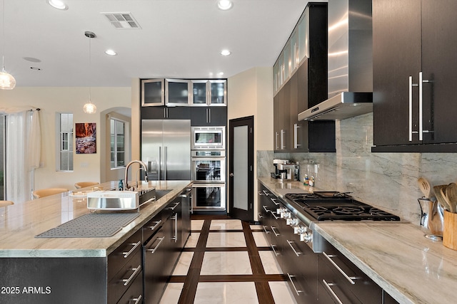 26036 N 85th Dr, Peoria, AZ 85383 - kitchen with built in appliances, wall chimney exhaust hood, a sink, recessed lighting, and backsplash