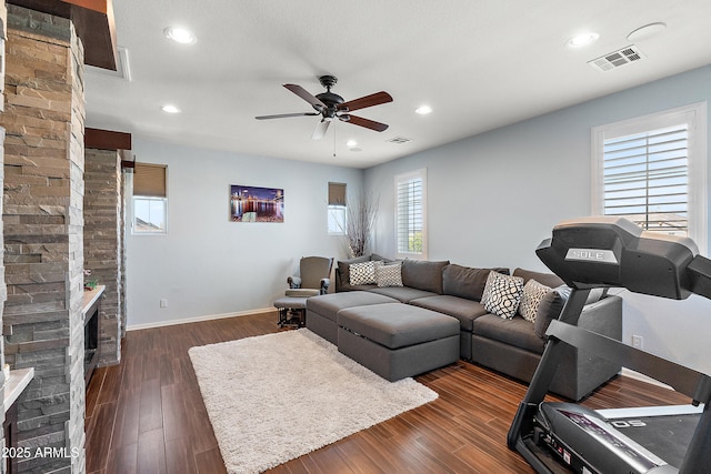 26036 N 85th Dr, Peoria, AZ 85383 - living area featuring ceiling fan, a fireplace, baseboards, dark wood-type flooring, and recessed lighting