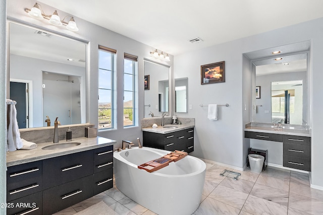 26036 N 85th Dr, Peoria, AZ 85383 - bathroom with marble finish flooring, plenty of natural light, a soaking tub, and two vanities