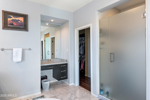 26036 N 85th Dr, Peoria, AZ 85383 - full bath featuring a stall shower, vanity, a spacious closet, marble finish flooring, and baseboards