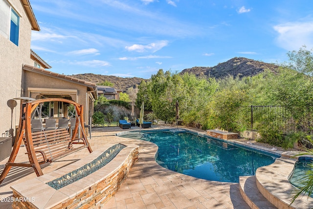 26036 N 85th Dr, Peoria, AZ 85383 - view of swimming pool with a mountain view, a patio, and a fenced backyard