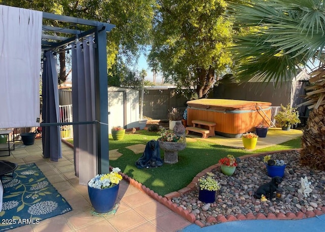 view of yard featuring a pergola, a patio area, and a hot tub