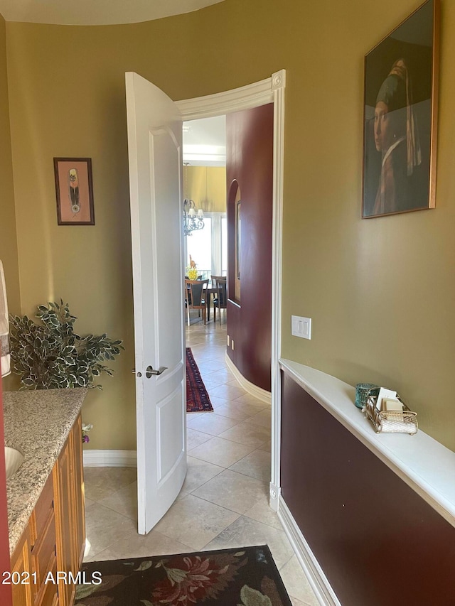 bathroom featuring tile floors and vanity