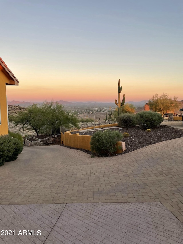 view of patio terrace at dusk