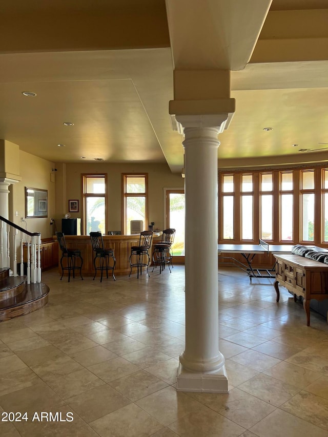 tiled dining room with decorative columns