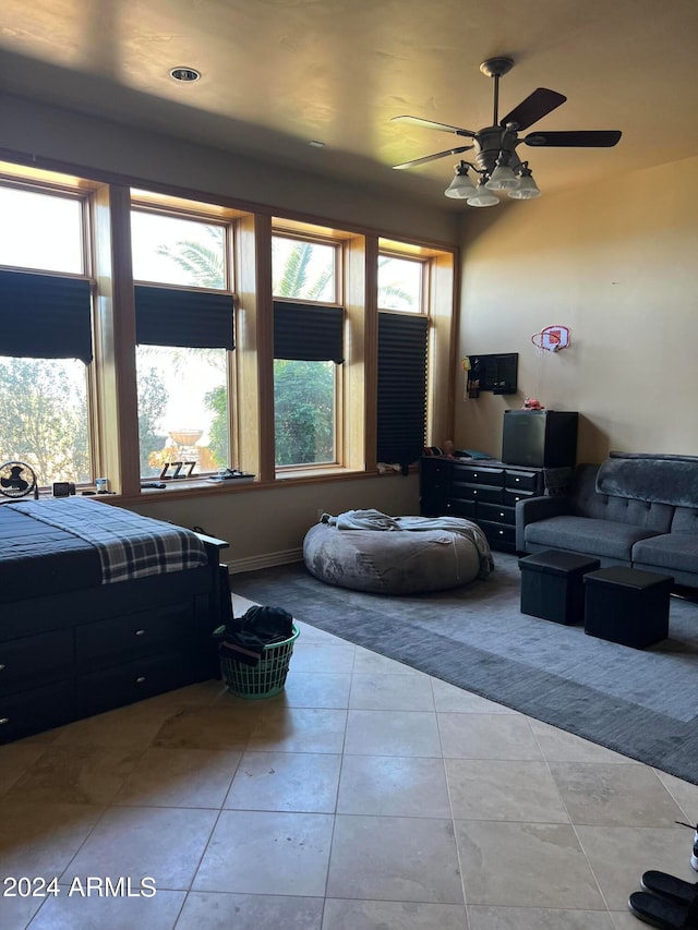 bedroom with tile floors and ceiling fan