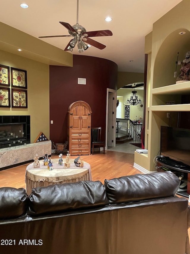 living room with hardwood / wood-style flooring and ceiling fan