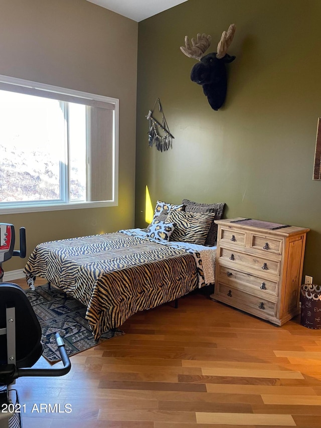 bedroom featuring hardwood / wood-style floors