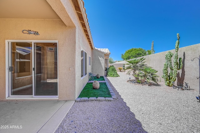 view of yard featuring a fenced backyard and a patio