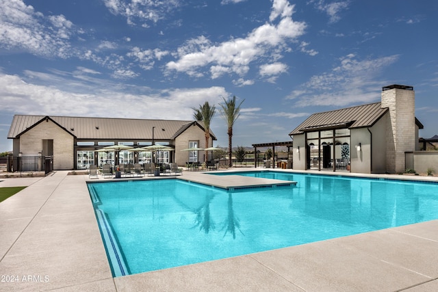 view of pool with a patio area and a pergola