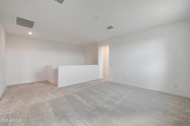 unfurnished room with light carpet