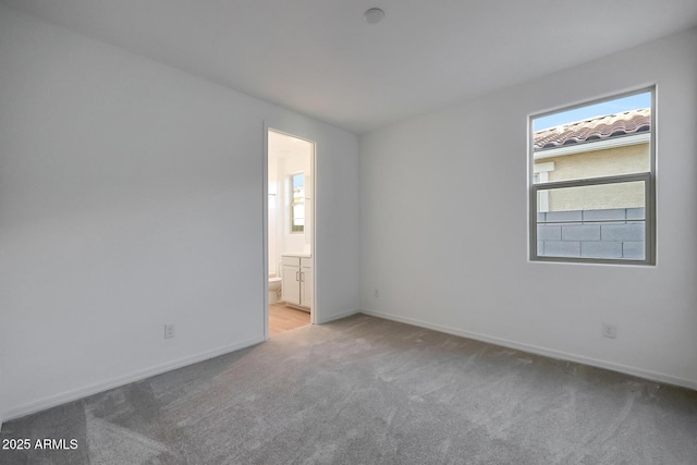 carpeted spare room with plenty of natural light