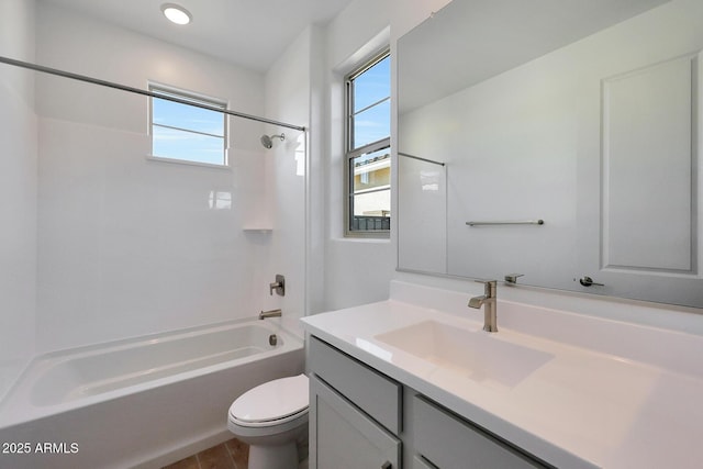 full bathroom featuring shower / washtub combination, vanity, and toilet