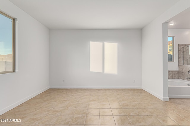 empty room with light tile patterned floors