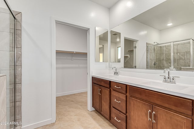 bathroom with vanity and an enclosed shower