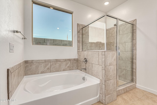 bathroom with tile patterned flooring and plus walk in shower