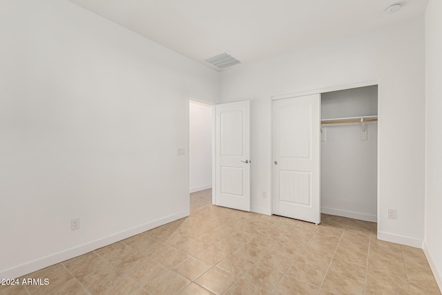 unfurnished bedroom featuring a closet