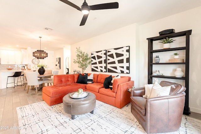 2511 W Queen Creek Rd Unit 325, Chandler, AZ 85248 - living area featuring ceiling fan, a chandelier, and light wood finished floors