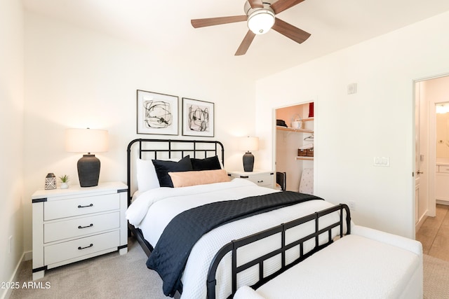 2511 W Queen Creek Rd Unit 325, Chandler, AZ 85248 - bedroom with a spacious closet, ceiling fan, light colored carpet, and a closet