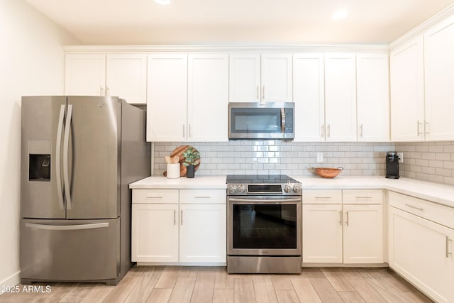 2511 W Queen Creek Rd Unit 325, Chandler, AZ 85248 - kitchen with appliances with stainless steel finishes, white cabinets, light countertops, and recessed lighting