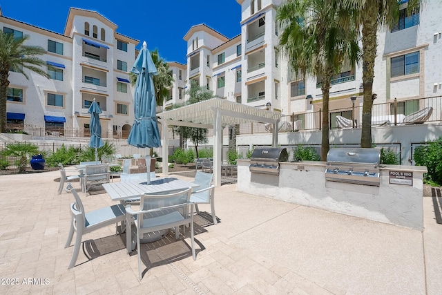 2511 W Queen Creek Rd Unit 325, Chandler, AZ 85248 - view of patio featuring an outdoor kitchen and outdoor dining space