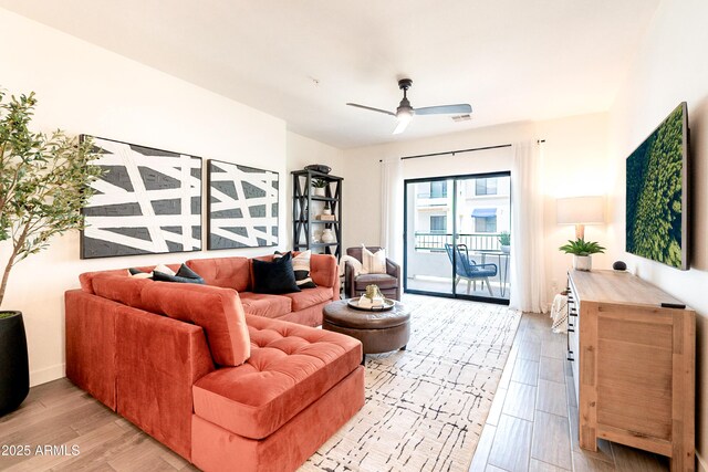2511 W Queen Creek Rd Unit 325, Chandler, AZ 85248 - living room with light wood finished floors and a ceiling fan