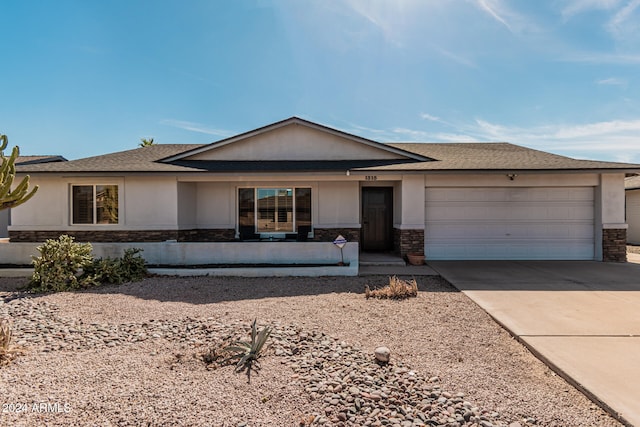 single story home featuring a garage