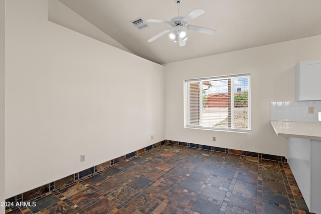 interior space with ceiling fan and vaulted ceiling