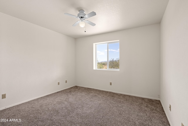 unfurnished room with carpet floors and ceiling fan