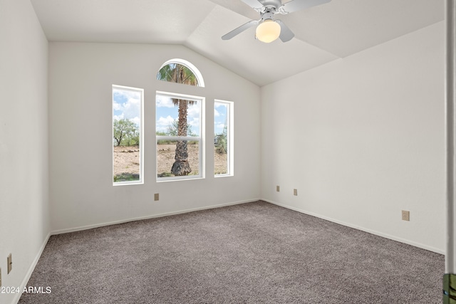 carpeted empty room featuring ceiling fan and lofted ceiling