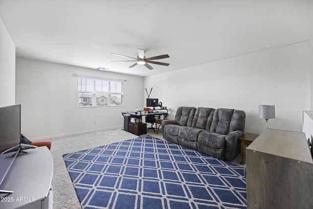 carpeted living room with ceiling fan