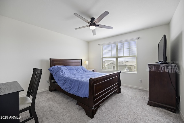 bedroom featuring ceiling fan and light carpet