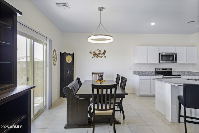 tiled dining space with sink