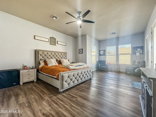 bedroom with a ceiling fan, dark wood finished floors, visible vents, and baseboards