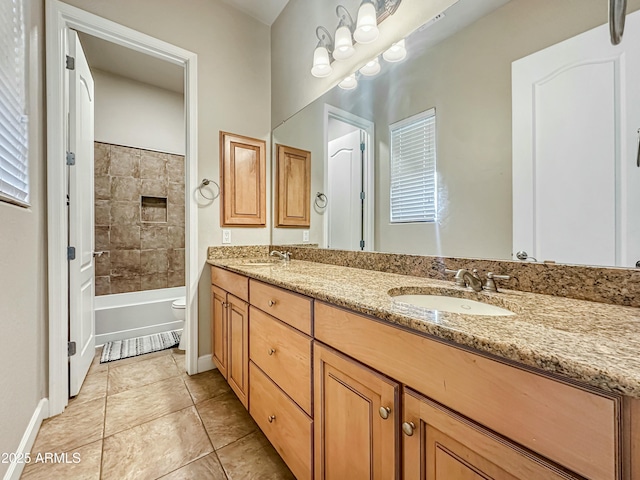 full bathroom featuring tile patterned floors, a sink, toilet, and double vanity