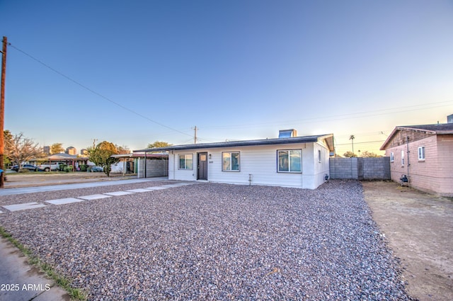 single story home with a carport