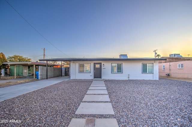 view of front of property featuring a carport