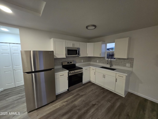 kitchen featuring white cabinetry, appliances with stainless steel finishes, and sink