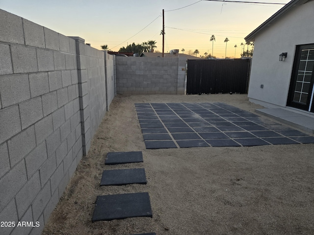 view of patio terrace at dusk