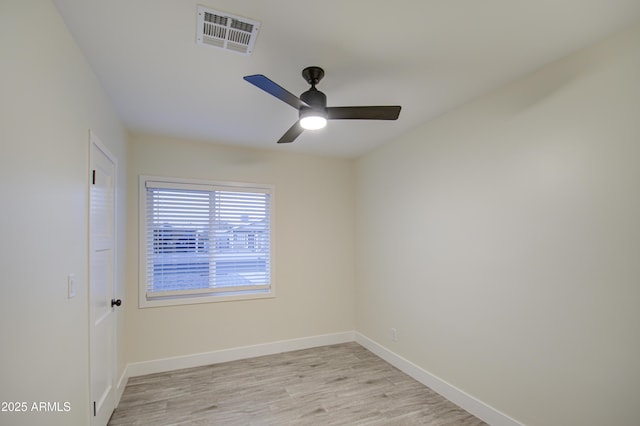 empty room featuring ceiling fan and light wood-type flooring