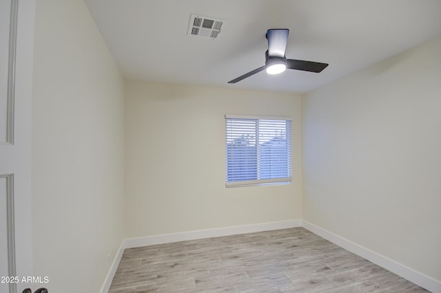 unfurnished room with ceiling fan and light wood-type flooring