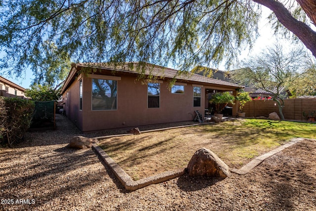 back of house with a yard