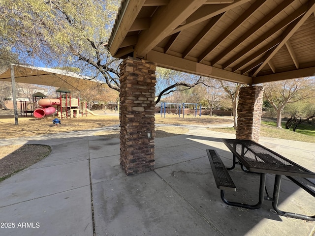 view of patio / terrace with a gazebo and a playground