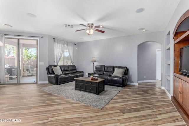 living room with ceiling fan