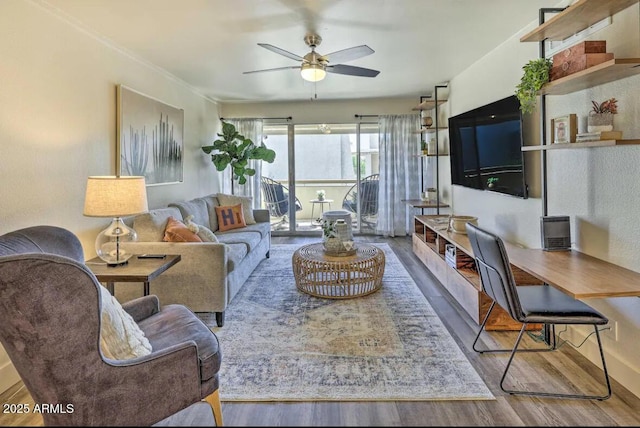 living room with ceiling fan and wood finished floors