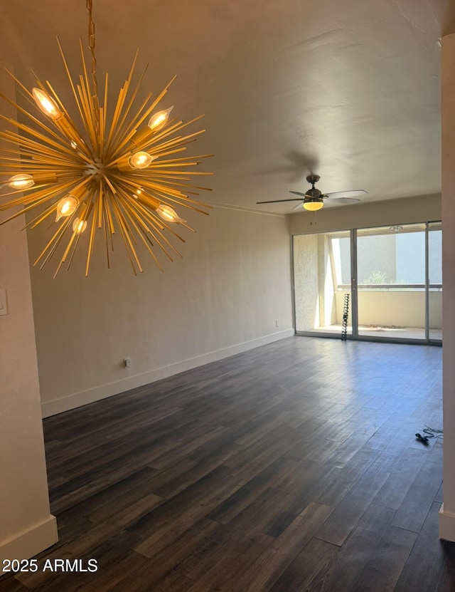 empty room featuring dark wood-style floors, ceiling fan, and baseboards